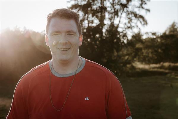 A man smiling to the camera